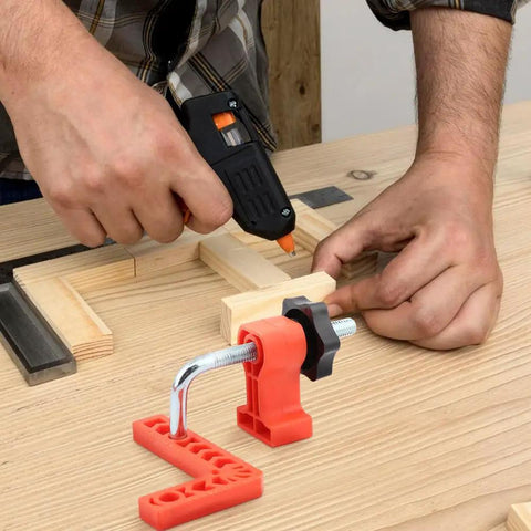 Sixteen Piece Right Angle Clamp Set For Woodworking with 90 Degree Positioning Squares on a wooden workbench