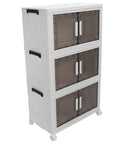 Super Sturdy Folding Storage Bins With Four Rollers For No Sweat Moving Quick Assembly Durable Plastic Bins stacked in white with brown handles