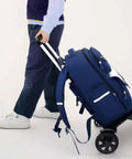 Person pulling Transformable Backpack Trolley Cart With Aluminum Alloy Frame And Two Large Tank Wheels, side view
