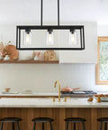 6 Light Dining Room Fixture In Black Modern Farmhouse Industrial Chandelier Rectangular Pendant Lighting For Dining Room Kitchen Island And Bar Height Adjustable Chains For Custom Fit And Chill Vibe with three visible bulbs over a kitchen island.