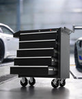 5-Drawer Rolling Tool Chest With Lockable Cabinet And Wheels in a garage setting, heavy-duty metal with smooth-glide drawers and black finish.