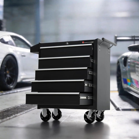 5-Drawer Rolling Tool Chest With Lockable Cabinet And Wheels in a garage setting, heavy-duty metal with smooth-glide drawers and black finish.