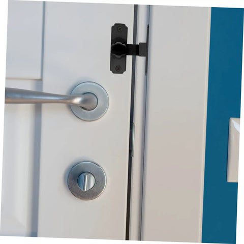 Four Pack Heavy Duty Sliding Door Lock With A Rock Solid 90 Degree Lever and Built Tough Construction on a white door.
