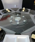 Extra Large Round Glass Lazy Susan Turntable on a dining table with black plates and napkins.
