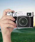 Metal Hot Shoe Thumb Up Grip For Fuji X100V X100VI Camera Black held against a scenic background