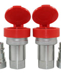 Two 1/2-inch hydraulic quick-connect couplers with red flip caps, knurled silver bodies, and matching plugs.