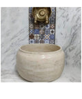 Travertine Marble Hammam Basin 16.5 x 9.8 inches Modern Oval Design for Bathroom Spa and Turkish Bath Use Stone Sink Durable and refined Beige Color, close-up view.