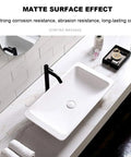 Slick Polished Artificial Stone Countertop Bathroom Sink With Integrated Drain Heavy Duty Oval Art Basin For Modern Vanity Cabinet Zero Hassle Scratch Proof Finish mounted above a white countertop with black faucet.