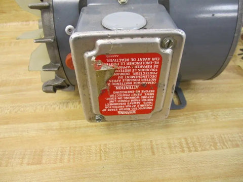 Close-up view of the back end of 3/4 HP Electric Motor 1725 RPM 115/230V 60 Hz SCS Type Code L 40C Ambient with label.