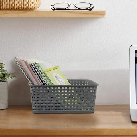Pack Of Six Gray Plastic Storage Baskets, Durable Stackable Organizer Bins, 10.03 In By 7.59 In By 4.09 In, on a desk holding notebooks