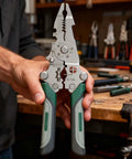 Badass 12 In 1 Foldable Wire Stripper And Cable Cutter Pliers held in hand, showcasing grip and multi-function design for tough job sites.
