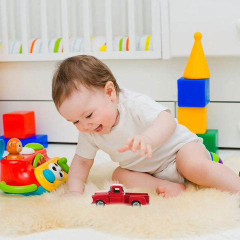 Baby playing with 4.72 Inch Miniature Pickup Truck Model Alloy Metal Figurine For Collectors Who Dig on fluffy rug
