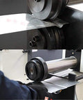 Close-up of Badass Heavy Duty Electric Bead Roller And Sheet Metal Crimper With 8 Inch Throat Depth using sheet metal.