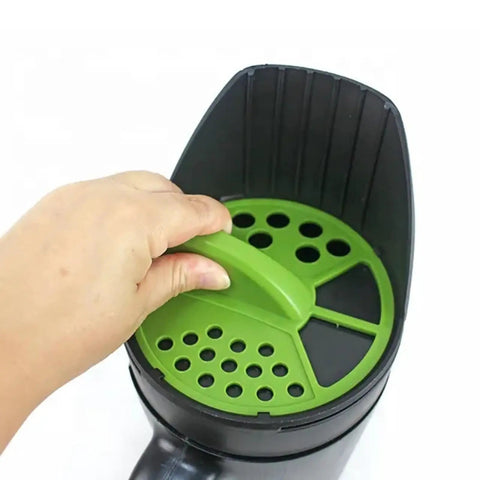Close-up of hand adjusting seed hole size on 8 In 1 Hand Held Seed Spreader And Planter Tool With Fertilizer Dispenser Seed Hole Maker