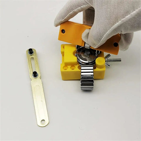 Using 147Pcs Watch Repair Tool Kit with Portable Case for Band Link Removal and Watch Maintenance, with gloves and yellow tool holder.