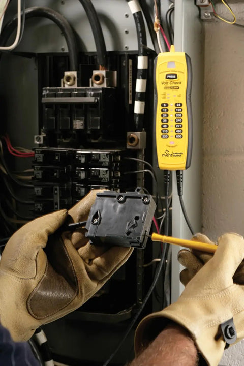 Technician using Voltage And Continuity Tester With Non Contact AC Detection 50 600V AC Range DC Polarity Indication Twin Probes