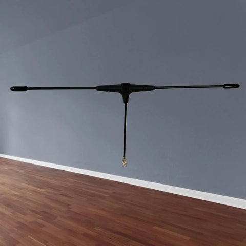 915MHz FPV Antenna For ELRS EP1 RX IPEX1 And TBS Tracer RC Systems 40mm Compact Long Range Drone Antenna in a room.