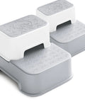 Two Step Toddler Stool Set Of Two, Super Sturdy Non Slip Bath Footrest For Kids Potty Training And Sink Washing, Straight Up Essential For Growing Toddlers, Wide Grip Platform, Light Grey. Compact grey stools with textured tops.