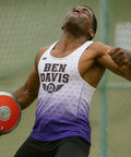 Athlete with 70 Percent Rim Weight Discus With Galvanized Steel Rim And ABS Plates, preparing for throw. Focused expression.