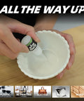 Person using All Purpose Super Glue For Plastic, Wood, Leather, Jewelry And Paper, 2610 PSI bond in seconds on a ceramic bowl