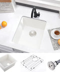 Top view of Undermount White Bar Sink 15x17 Deep Single Bowl for Wet Bar and RV Kitchen, Quartz Composite with accessories.