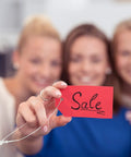 One Thousand Pack Of 5 Inch Adjustable Security Beaded Loop Ties With Snap Lock Pins Ideal For Retail Price Tags And Shipping Seals With Rock Solid Tamper Protection And Straight Up Effortless Hook Up Anywhere, showing women holding a sale tag.