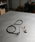 Black Spring-Loaded Gate Latch Cable Pull for Garden Wood Vinyl Fence components including spring, cable, and hardware.