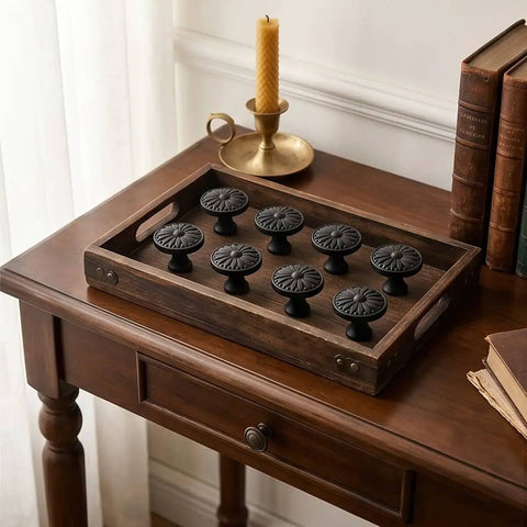 Ten Pack Matte Black Kitchen Cabinet Knobs One And A Quarter Inch Diameter Zinc Alloy Drawer Pulls on wooden tray