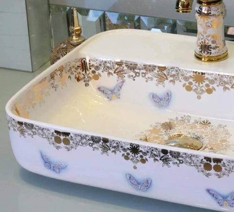 USZWBY Bathroom Sink, Countertop Basin Ceramic Ceramic Countertop Sink with gold floral design and butterfly accents.