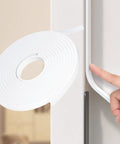 Top Tier White Weather Stripping Tape For Doors And Windows Self Adhesive High Density Foam Roll 16 4 Feet unrolled near door