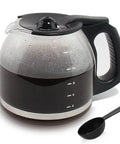 Front view of 12-cup glass coffee carafe with black handle and lid; condensation on glass, cup scale to 12, plus scoop.