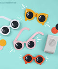 Circle Punch 1.75 Inch With Safety Lock For Clean Crisp Circles In Cardstock on blue background with paper sunglasses