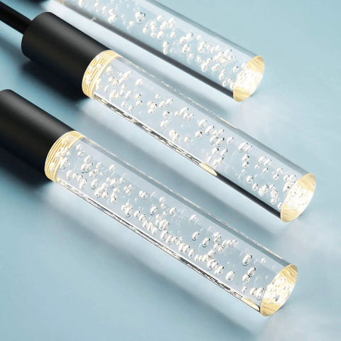 Close-up of crystal bubble shades on a dimmable LED ceiling pendant light with six lights, modern industrial chandelier.