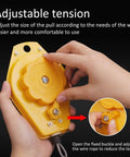 Hands adjusting a yellow Retractable Spring Balancer for Tools, 3 to 5 kg, with fixture holder and heavy-duty bearing system.