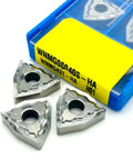 Premium Wnmg0804 Ha H01 Hard Alloy CNC Turning Insert angled view with pack, suitable for aluminum working with smart chip breaker.