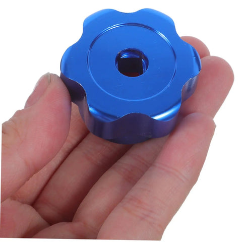 Hand holding Blue Round Wheel Handwheel Outdoor Faucet Handle Replacement For Hose Bib And Spigot Stem 6.6mm Hole Aluminum Alloy Valve Handle Kit