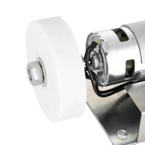 Close-up of Smooth Operator Mini Belt Sander And Bench Grinder with white polishing wheel and motor for woodworking and metal buffing.