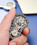 Hand holding Bike Chain Gear Fidget Spinner Metal EDC Toy For Stress Relief And Focus Durable Black Finish Portable Office Spinner
