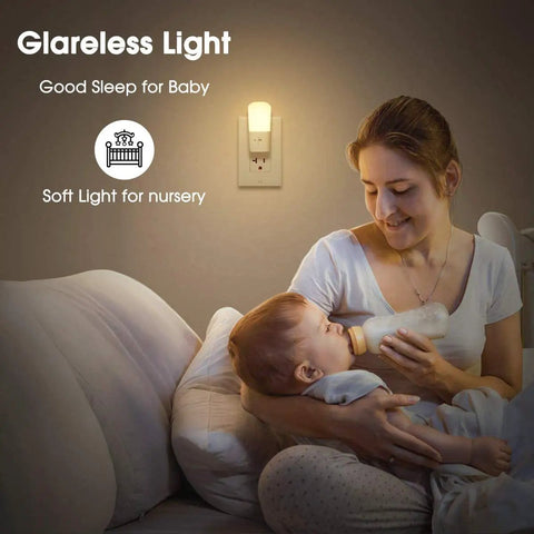 Mother with baby in dimly lit nursery using Dimmable LED Plug In Night Light With 5 To 80 Lumens Brightness And Dusk To Dawn Sensor
