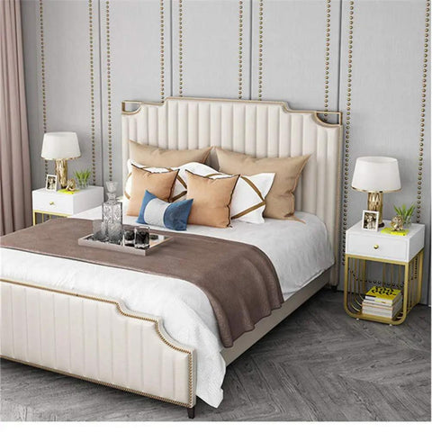 Modern Metal Nightstand With Two Smooth Drawers Heavy Duty Bedside Table beside a stylish bed with decorative pillows.