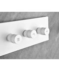 Wall Mounted Waterfall Shower System with Hand Shower control knobs in white, featuring modern design for easy water adjustment.