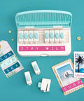 Word Punch Board For Scrapbooking And Card Making Dope Letter Punch Set With 26 Letters and alignment base on teal background