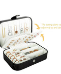 Open Travel Jewelry Case With PU Leather Exterior and Velvet Lining showing compartments for necklaces, rings, earrings