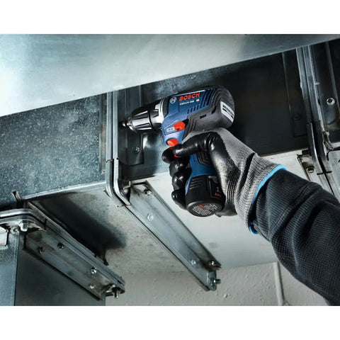 Worker using 12V Max EC Brushless 3/8 Inch Drill Driver Kit With Ultra Lightweight 1.6 Lb Tool in tight overhead space
