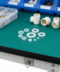 Bulk 500 Piece Nylon Washers Assortment Kit M2 to M8 Flat for Furniture, Electronics, and Machinery, Noise Reduction and Vibration Dampening, Durable Nylon Spacers for Quick Fixes and Hardware Projects, assorted white nylon washers on a workbench