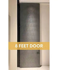 8-foot tall door with dark finish in sleek modern interior setting