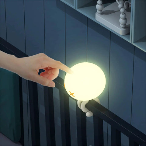 Hand touching Rechargeable Jellyfish LED Night Light For Nursery With Dimmable Touch Control 1800mAh Battery on crib mount