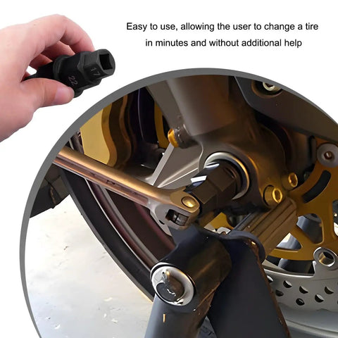 Hand using Beefy Heavy Duty Motorcycle Front Axle Tool Kit with hex adapters for wheel hub removal on bike.