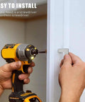 Installing Top Shelf Slick Brushed Nickel Cabinet Pulls And Drawer Handles with a cordless screwdriver.