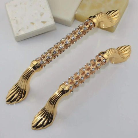 Level Up Your Cabinet Game With These Crisp 96Mm Drawer Pulls Decked Out In Glossy 24K Gold And Heavyweight K9 Crystal That Truly Bring The Hollywood Glamour Everyday, features shiny gold finish and crystal accents.
